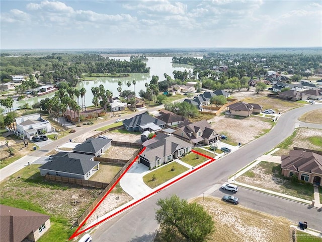 drone / aerial view featuring a water view