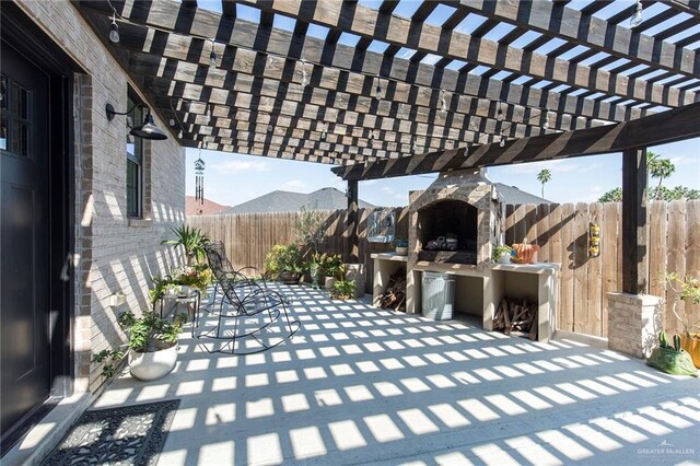 view of patio / terrace featuring a mountain view and a pergola