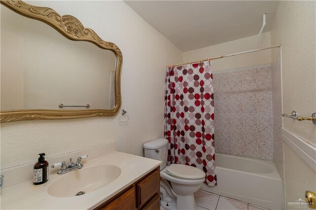 full bathroom with tile patterned flooring, vanity, shower / bath combination with curtain, and toilet