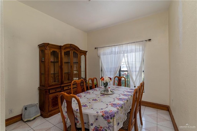 dining area with light tile patterned flooring