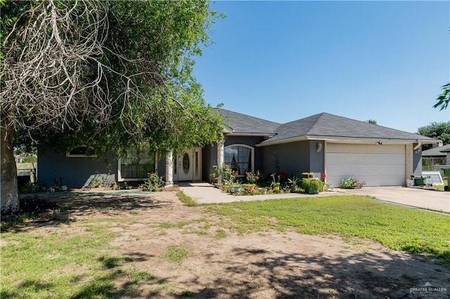 ranch-style house with a front yard and a garage