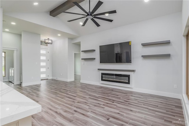 2316 Piedra St, Edinburg, TX 78542 - unfurnished living room featuring light wood finished floors, a ceiling fan, a glass covered fireplace, recessed lighting, and baseboards