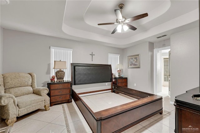 3704 San Gerardo St, Mission, TX 78572 - bedroom with ensuite bath, visible vents, light tile patterned floors, and a tray ceiling
