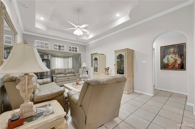 3704 San Gerardo St, Mission, TX 78572 - living room featuring a tray ceiling, arched walkways, baseboards, ceiling fan, and crown molding