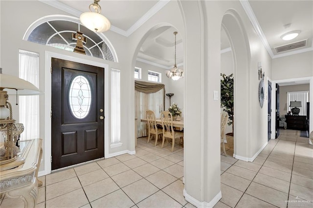 3704 San Gerardo St, Mission, TX 78572 - entryway featuring visible vents, light tile patterned flooring, crown molding, baseboards, and a notable chandelier