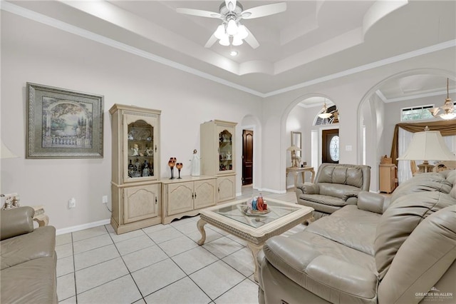 3704 San Gerardo St, Mission, TX 78572 - living room with a tray ceiling, arched walkways, a ceiling fan, crown molding, and light tile patterned floors