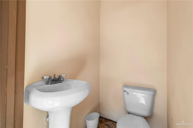 bathroom featuring sink and toilet