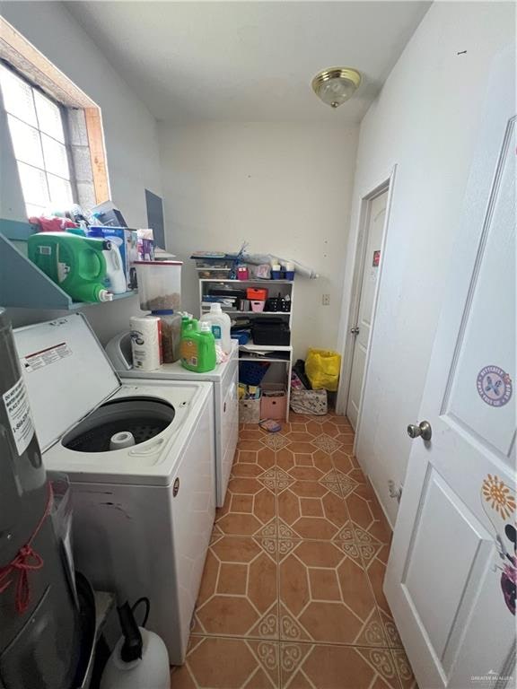 laundry room featuring washer and dryer and tile patterned floors