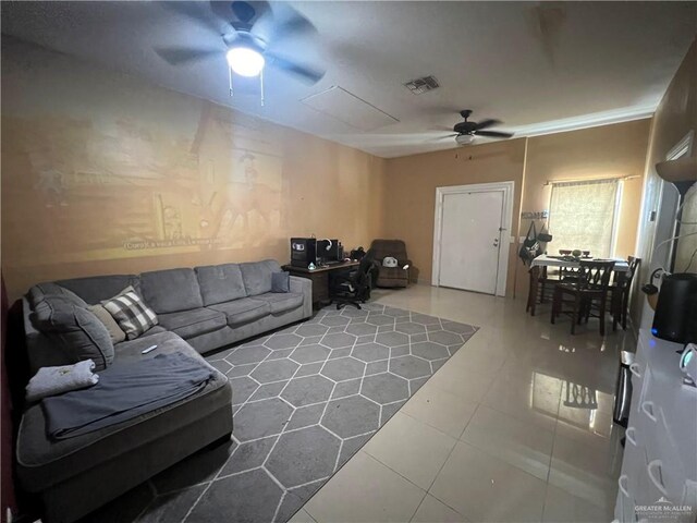 living room with tile patterned floors and ceiling fan