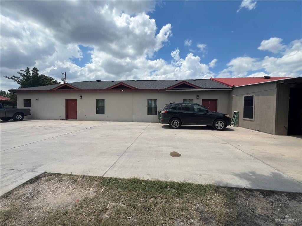 4508 N Mile 4 1/2 W, Weslaco, TX 78599 - view of home's exterior with stucco siding and driveway