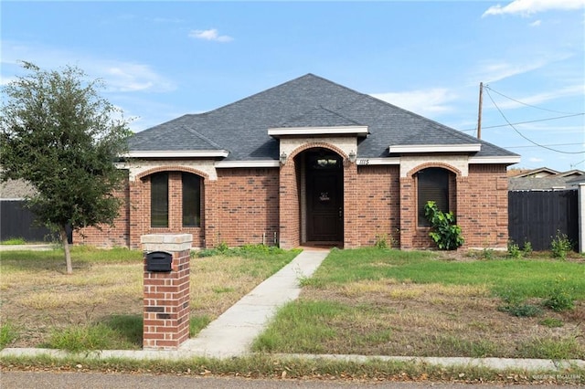 view of front of property with a front lawn