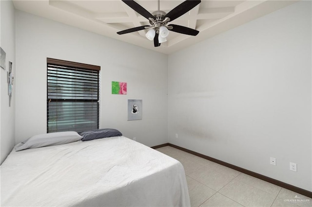 tiled bedroom featuring ceiling fan