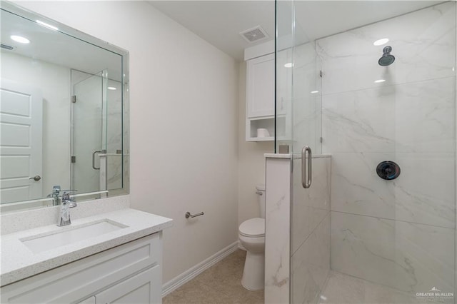 bathroom with walk in shower, vanity, and toilet