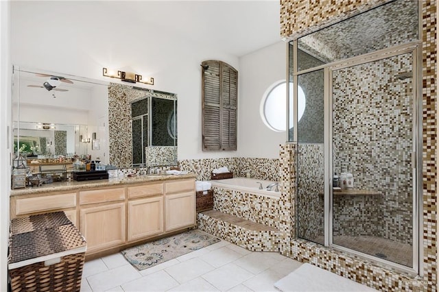 5512 Autumn Mist Ln, Brownsville, TX 78526 - bathroom featuring vanity, a ceiling fan, a garden tub, tile patterned flooring, and a stall shower