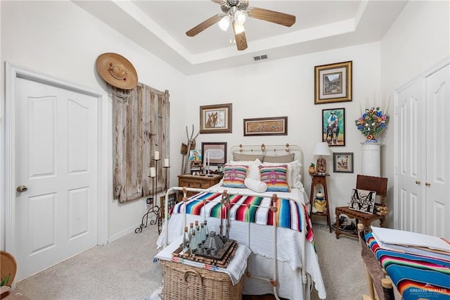 5512 Autumn Mist Ln, Brownsville, TX 78526 - carpeted bedroom featuring a raised ceiling, ceiling fan, and a closet