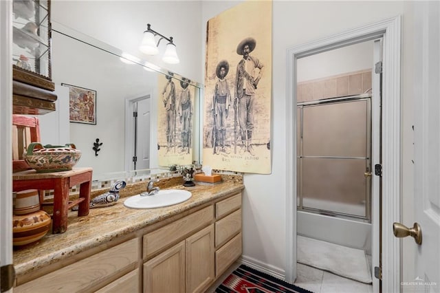 5512 Autumn Mist Ln, Brownsville, TX 78526 - bathroom featuring vanity, shower / bath combination with glass door, and tile patterned flooring