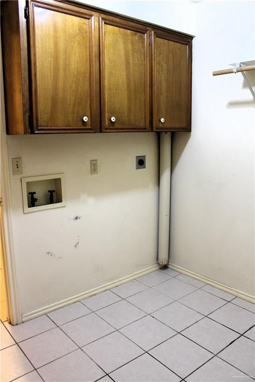 clothes washing area featuring cabinets, washer hookup, hookup for an electric dryer, and light tile patterned floors