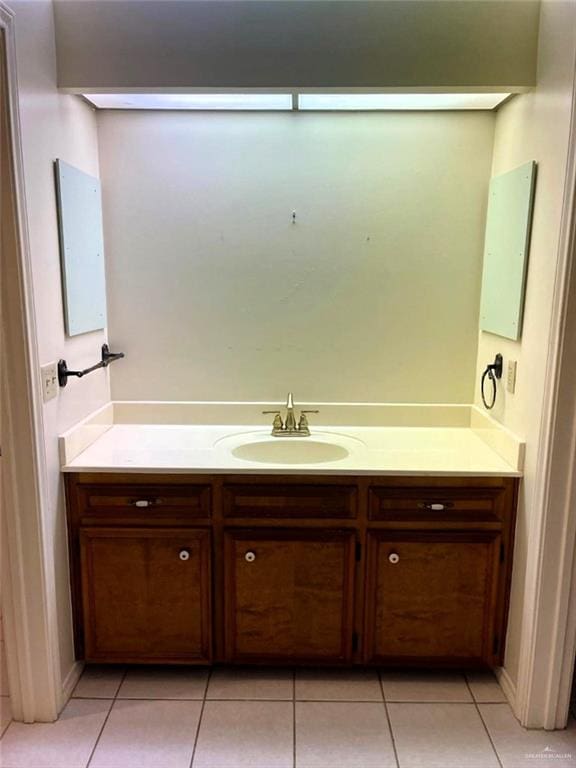 bathroom with vanity and tile patterned flooring