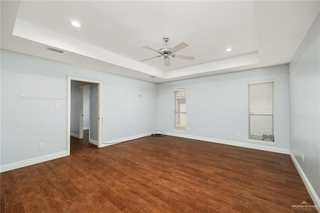 208 E Lark Ave, Mcallen, TX 78504 - unfurnished room with a raised ceiling, a ceiling fan, baseboards, recessed lighting, and wood finished floors