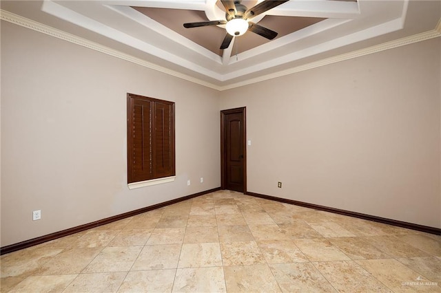 unfurnished room featuring ceiling fan, ornamental molding, and a raised ceiling