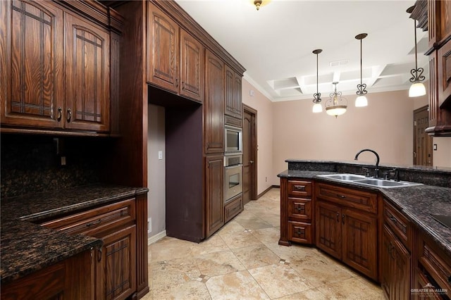 kitchen featuring appliances with stainless steel finishes, sink, hanging light fixtures, and dark stone countertops