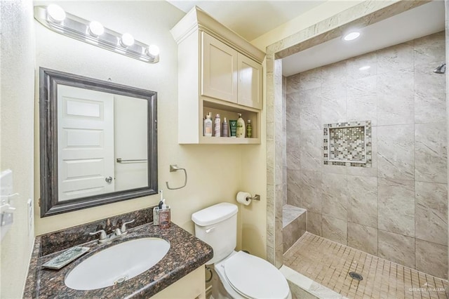 612 Valencia Ln, Brownsville, TX 78521 - full bath with toilet, a tile shower, and vanity