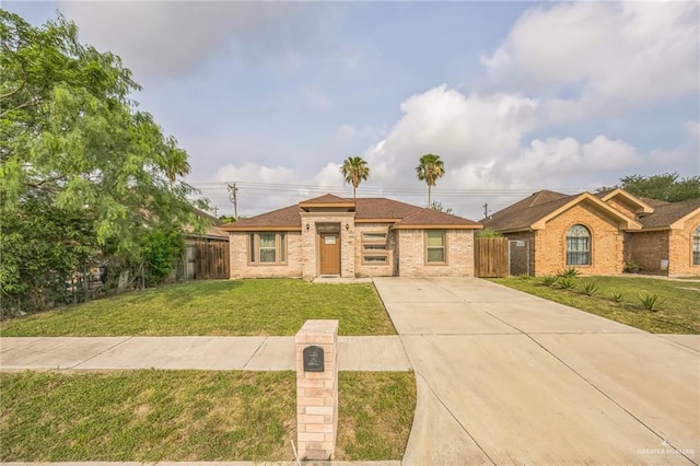 612 Valencia Ln, Brownsville, TX 78521 - view of front of property with brick siding and concrete driveway