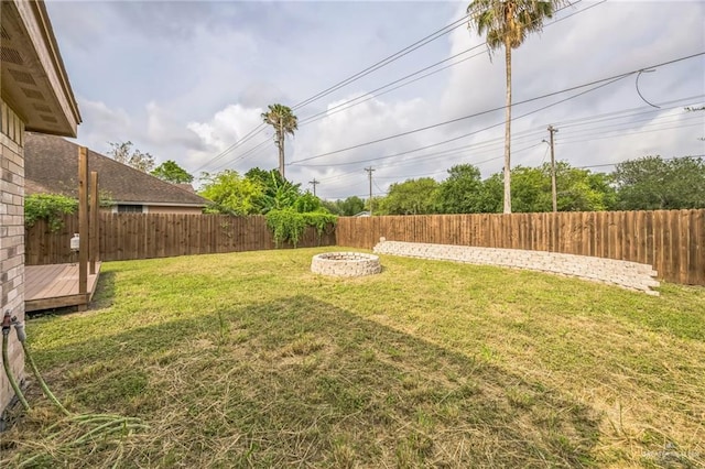 612 Valencia Ln, Brownsville, TX 78521 - view of yard featuring an outdoor fire pit
