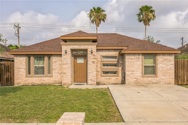 612 Valencia Ln, Brownsville, TX 78521 - view of front of property featuring roof with shingles and brick siding