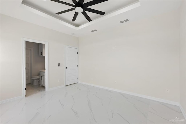 2203 San Charbel St, San Juan, TX 78589 - unfurnished bedroom featuring a raised ceiling, baseboards, and visible vents