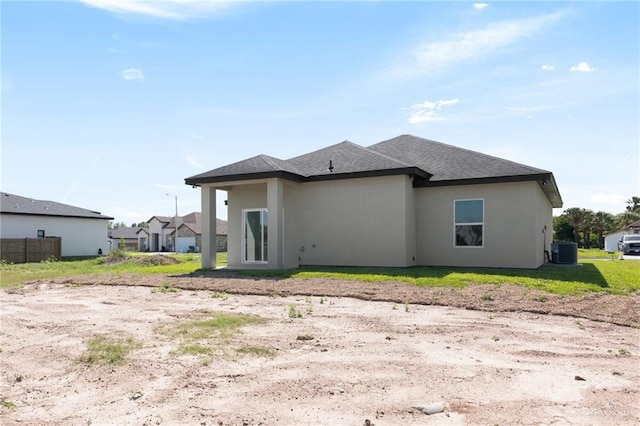 2203 San Charbel St, San Juan, TX 78589 - back of house with roof with shingles, central AC, and stucco siding