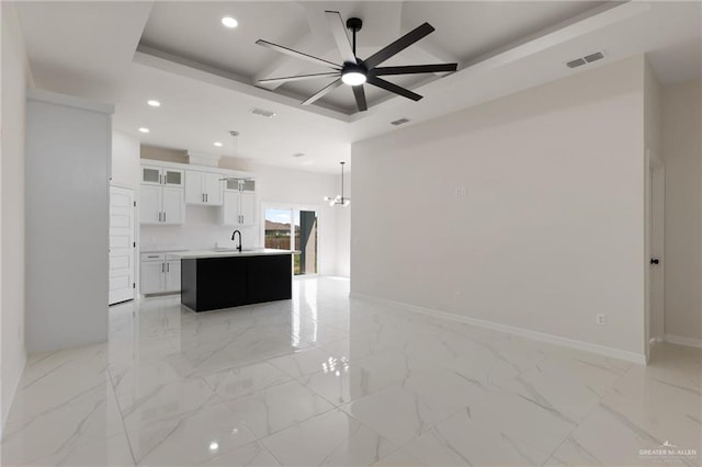 2203 San Charbel St, San Juan, TX 78589 - unfurnished living room with coffered ceiling, recessed lighting, visible vents, ceiling fan, and a sink