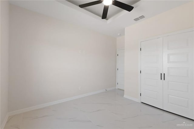2203 San Charbel St, San Juan, TX 78589 - unfurnished bedroom with visible vents, marble finish floor, and baseboards