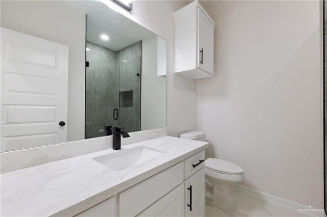 2203 San Charbel St, San Juan, TX 78589 - bathroom with baseboards, toilet, a shower stall, vanity, and marble finish floor