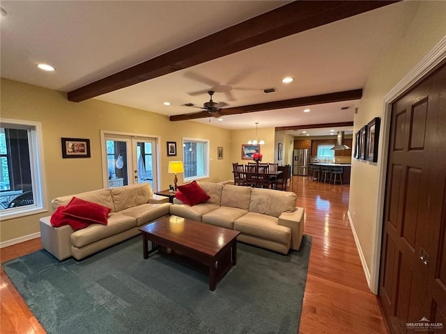 living room with beamed ceiling, recessed lighting, wood finished floors, and baseboards