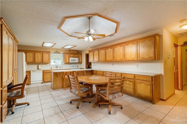 1717 Sun St, Mission, TX 78572 - dining room featuring a textured ceiling, ceiling fan, and light tile patterned flooring