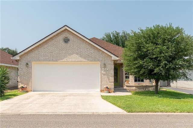 1717 Sun St, Mission, TX 78572 - single story home featuring brick siding, a front lawn, an attached garage, and concrete driveway