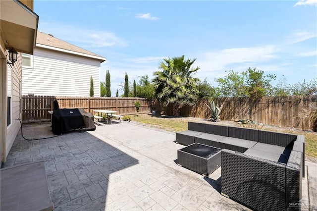 view of patio featuring a grill, a fenced backyard, and an outdoor hangout area