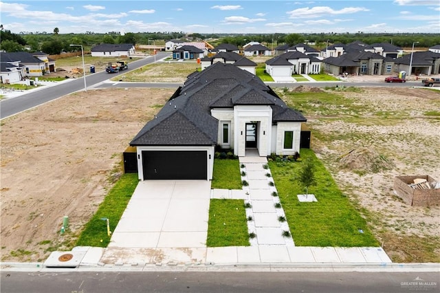 8104 N 51st St N, Mcallen, TX 78504 - view of front of property featuring a residential view, an attached garage, driveway, and roof with shingles