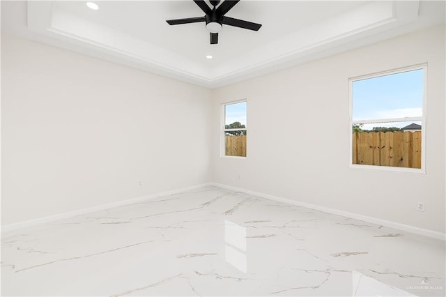 8104 N 51st St N, Mcallen, TX 78504 - empty room with marble tiled flooring, a raised ceiling, a ceiling fan, and recessed lighting