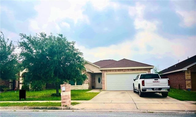 4214 Pedernal St, Edinburg, TX 78542 - view of front of house with a garage, concrete driveway, and a front yard