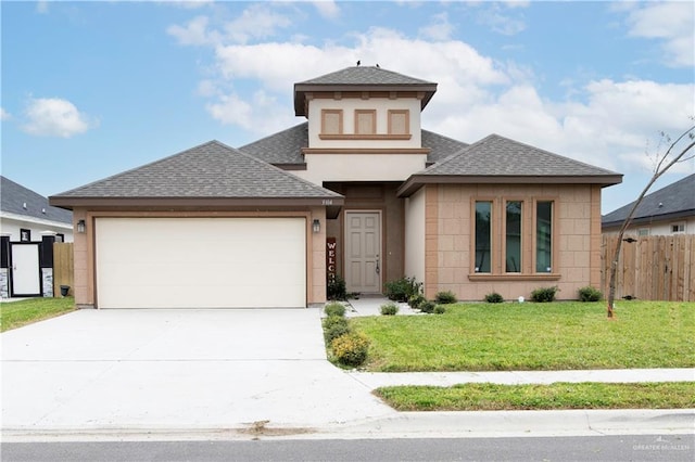 view of front facade with a garage and a front lawn