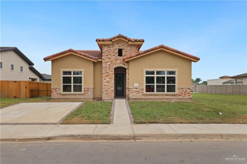 6430 El Camino Real, Harlingen, TX 78550 - mediterranean / spanish-style home featuring stucco siding and a tile roof