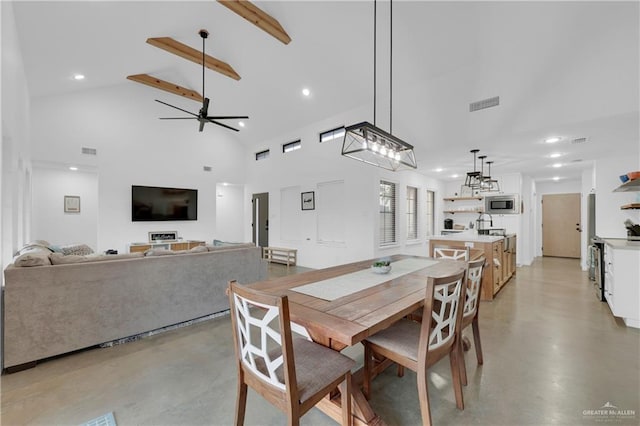 dining room featuring beamed ceiling, high vaulted ceiling, and ceiling fan