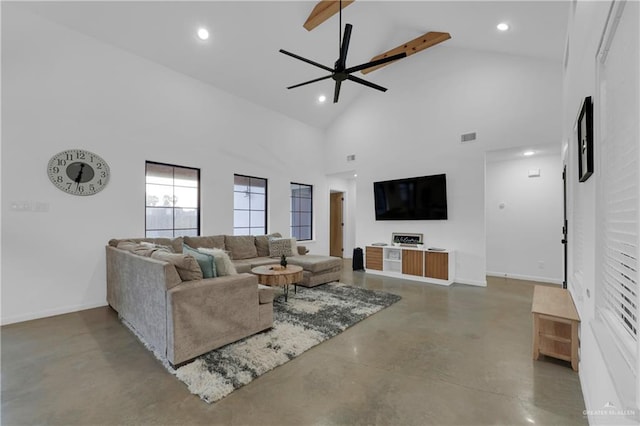 living room featuring ceiling fan, beam ceiling, concrete flooring, and high vaulted ceiling