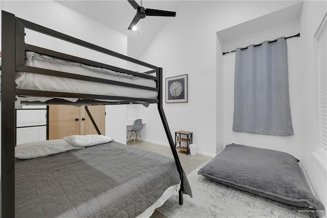 bedroom featuring vaulted ceiling and ceiling fan