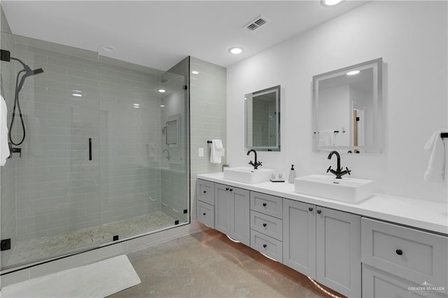 bathroom featuring vanity and a shower with shower door