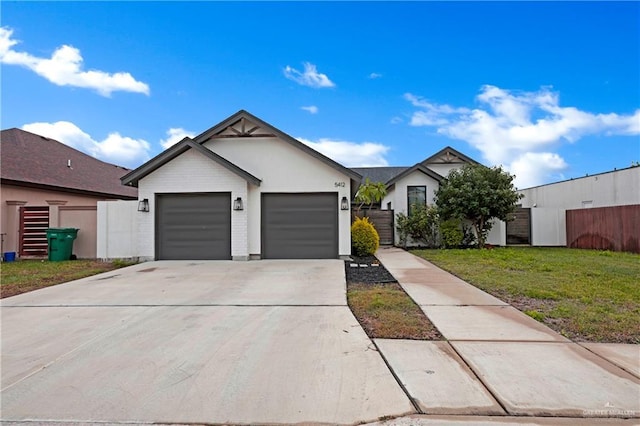 ranch-style home with a garage and a front yard