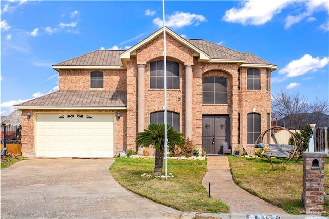 front facade featuring a garage and a front lawn