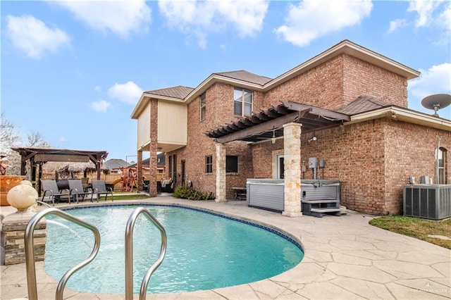 view of pool with a hot tub, cooling unit, a patio area, and a pergola